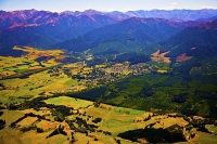 Aerial;Hanmer_Springs;green_fields;paddocks;brown_hills;hills;mountains;blue_sky