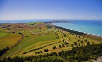 Aerial;Kaikoura_Peninsula;seaward_Kaikoura_Range;green_fields;paddocks;brown_hil